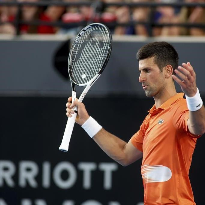 Djokovic shrugs off injury scare, wins Adelaide title